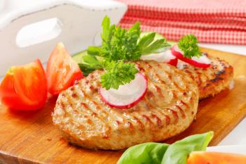 Pan fried patties with sliced vegetables