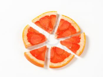 Slice of red grapefruit cut into sixths