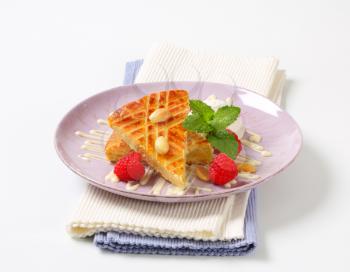 Almond cake with ice cream and fresh raspberries