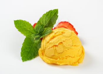 Scoop of yellow ice cream - studio shot