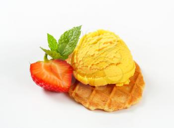 Thin butter waffle crisp with scoop of ice cream
