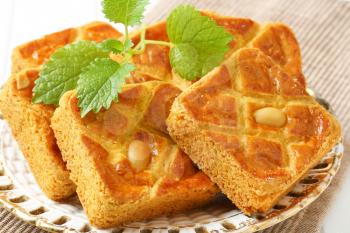 Small square cakes filled with thick almond paste