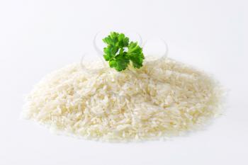 Heap of uncooked white rice