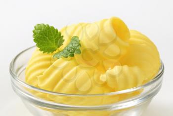 Curls of fresh butter in glass bowl