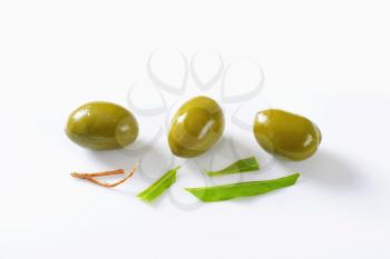 Unpitted green olives - studio shot