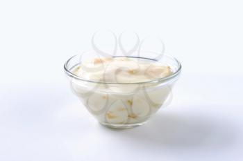 Bowl of fresh yoghurt with pieces of fruit