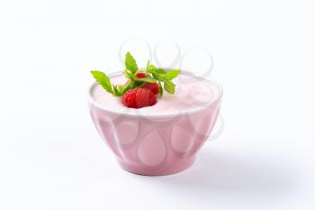 Light raspberry yogurt in pink porcelain bowl