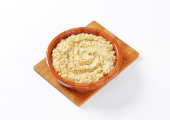 Bowl of white oats porridge