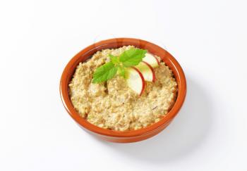 Bowl of white oats porridge