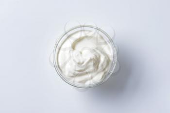 bowl of sour cream on white background