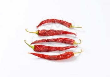 Dried Red Chili Peppers on white background