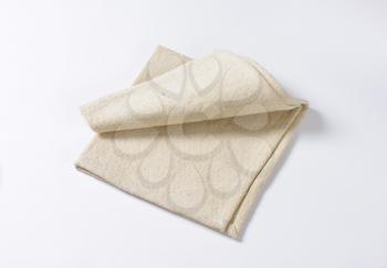 Small folded linen place mat