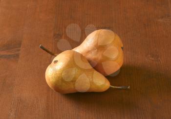 European pears with elongated slender neck and russeted skin