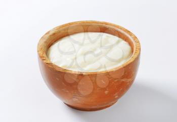 Plain semolina porridge in wooden bowl