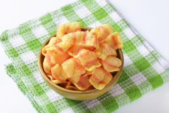 Bowl of bacon-flavored puffed wheat chips