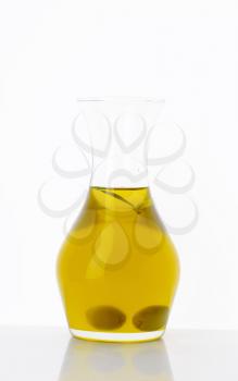 Olive oil in clear glass carafe