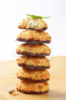 Pile of coconut macaroons dipped in chocolate