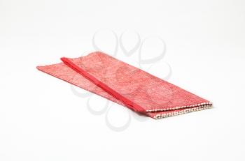 Folded red cloth place mat