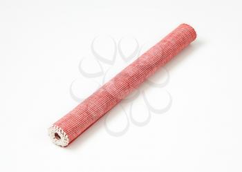 Rolled red cloth place mat