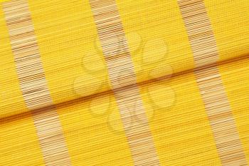 Detail of yellow bamboo place mat