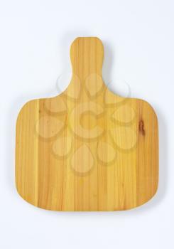 wide paddle-shaped wooden cutting board