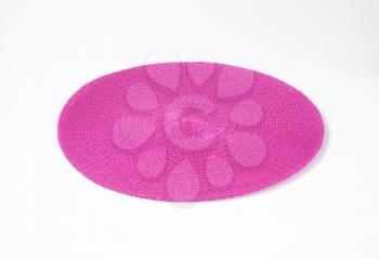 Round purple table mat on white background