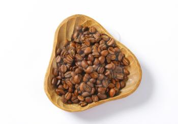 bowl of coffee beans on white background