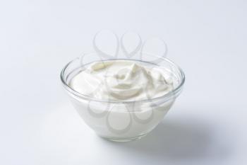 bowl of sour cream on white background