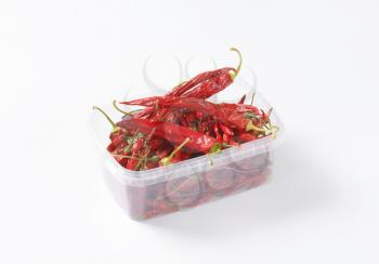 Dried Red Chili Peppers in plastic food container