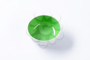 Empty coupe bowl - white on the outside, green on the inside