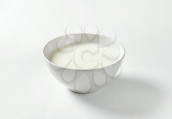 bowl of milk on white background