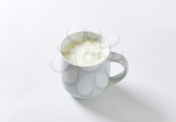 mug of milk kefir on white background