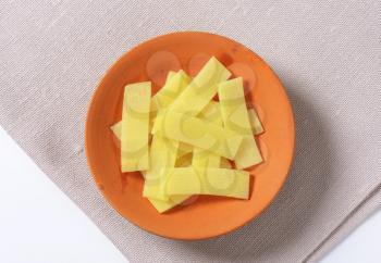 bowl of sliced bamboo shoots on place mat