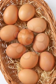 fresh brown eggs in basket