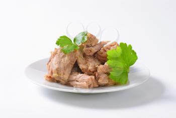 chunks of canned tuna on white plate