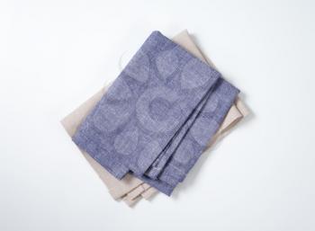 folded blue and gray napkins