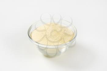 Heap of semolina flour in a glass bowl