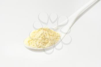Heap of semolina flour on a spoon