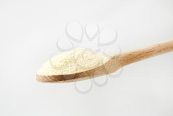 Semolina flour on a wooden spoon