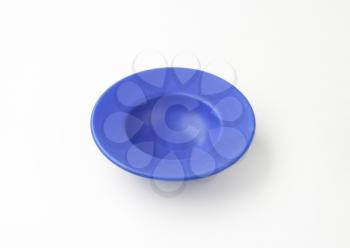deep blue plate with wide rim