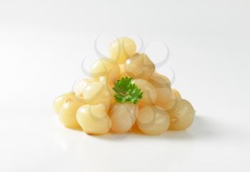 Heap of small pickled onions