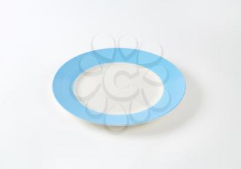 Dinner plate with wide light blue rim