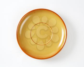 Light brown saucer with tan edge