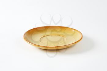 Light brown saucer with tan edge