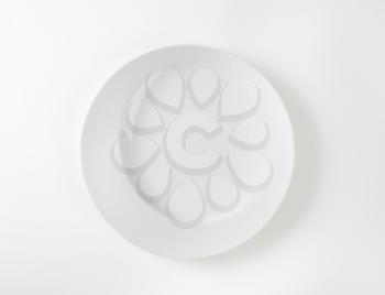 White dinner plate with irregular rim