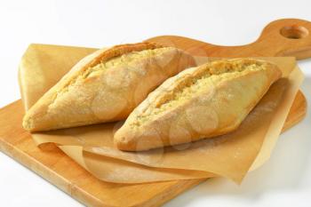 White sourdough bread rolls with crispy crust