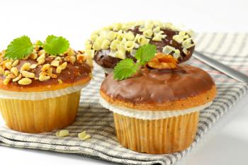Assorted muffins - one chocolate muffin, two muffins with nuts
