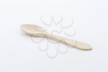 Small disposable natural wood spoon