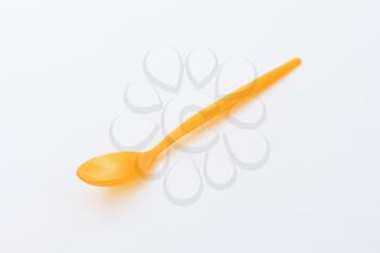Orange plastic spoon for daily use