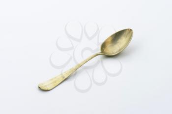 Old metal spoon with deep cup